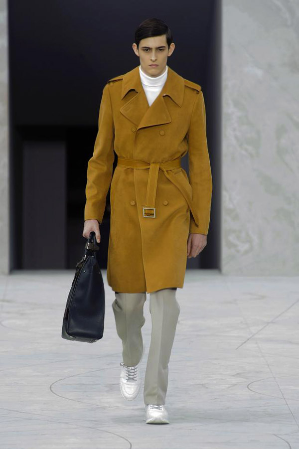 Louis Vuitton Menswear Ready to Wear Spring Summer Model long blond hair  wearing dark green pyjamas under long beige coat Stock Photo - Alamy