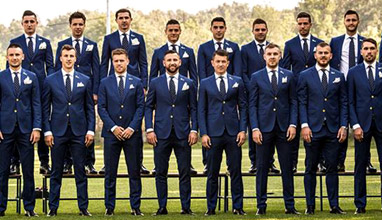 Romanian football team dressed in tailored suits by Viggo and Dormeuil for UEFA Euro 2016