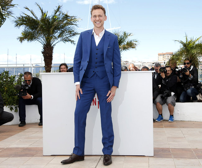 Well-fitting suits and smiles by Tom Hiddleston