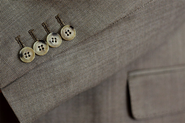 The suit details: Working cuffs and kissing buttons